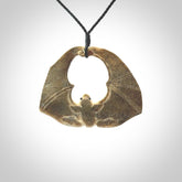 Hand carved bat Pendant. Made from Deer antler in New Zealand. Unique bat necklace hand made from deer antler by master bone carver Fumio Noguchi. Spectacular collectable work of art, made to wear. One only pendant, delivered to you with express courier.